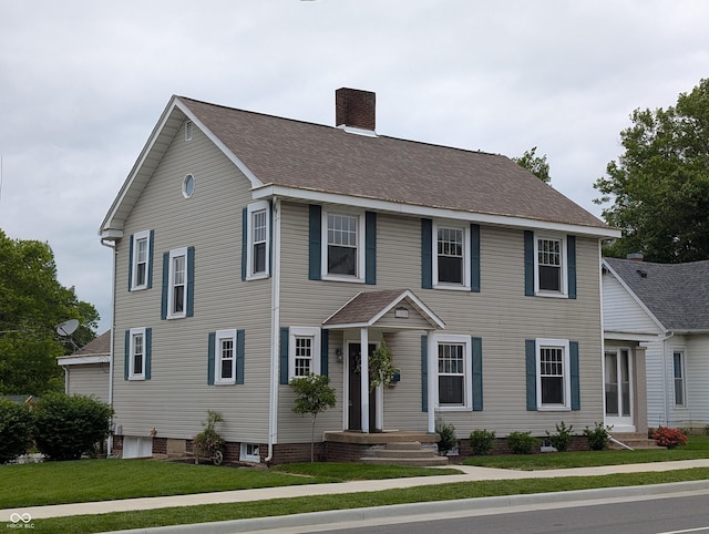 150 W Walnut St, North Vernon, IN 47265 - colonial-style house with a chimney and a front yard
