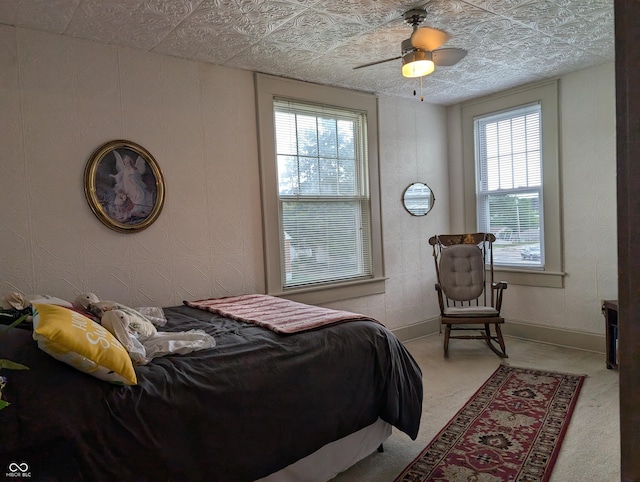 150 W Walnut St, North Vernon, IN 47265 - bedroom with multiple windows, carpet flooring, baseboards, an ornate ceiling, and ceiling fan