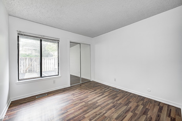 5097 Vantage Point Rd Unit B 2, Avon, IN 46123 - unfurnished bedroom with wood finished floors, a textured ceiling, baseboards, and a closet