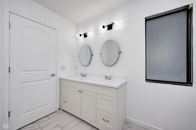 5097 Vantage Point Rd Unit B 2, Avon, IN 46123 - bathroom featuring marble look tiles, double vanity, and baseboards