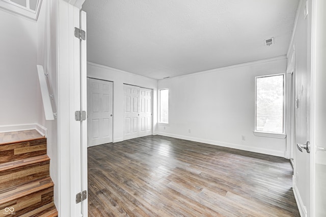 5097 Vantage Point Rd Unit B 2, Avon, IN 46123 - unfurnished bedroom featuring ornamental molding, wood finished floors, baseboards, and a textured ceiling