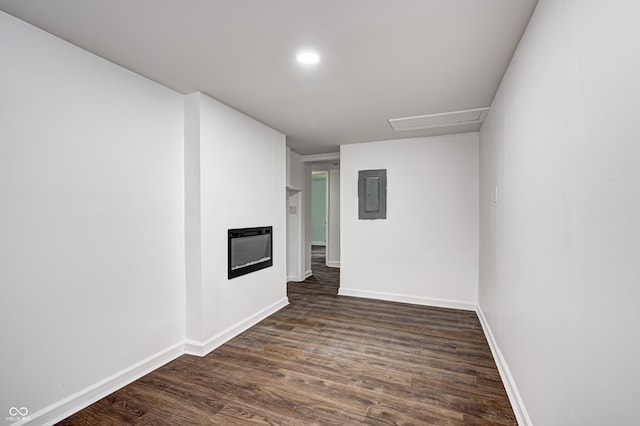5097 Vantage Point Rd Unit B 2, Avon, IN 46123 - empty room featuring electric panel, dark wood-type flooring, a glass covered fireplace, baseboards, and recessed lighting