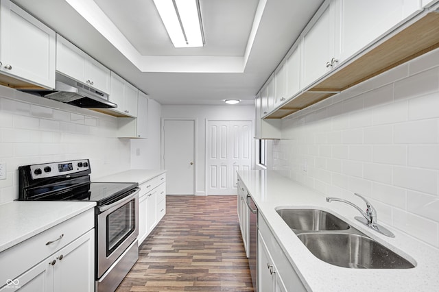 5097 Vantage Point Rd Unit B 2, Avon, IN 46123 - kitchen with stainless steel appliances, decorative backsplash, a sink, white cabinets, and dark wood finished floors