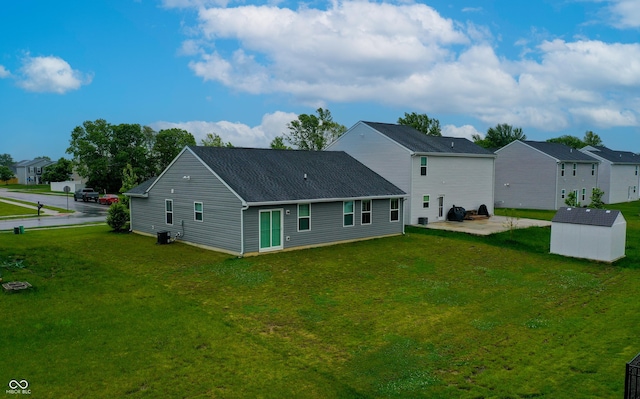 9829 Hulton Rd, Pendleton, IN 46064 - rear view of house with a patio area, a lawn, a residential view, and roof with shingles