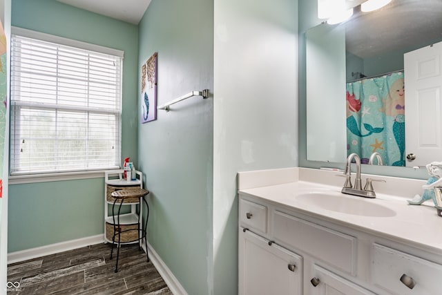 11919 Gatwick View Dr, Fishers, IN 46037 - bathroom with vanity, wood finished floors, and baseboards