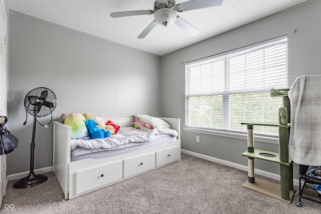 11919 Gatwick View Dr, Fishers, IN 46037 - carpeted bedroom featuring a ceiling fan, baseboards, and a textured ceiling