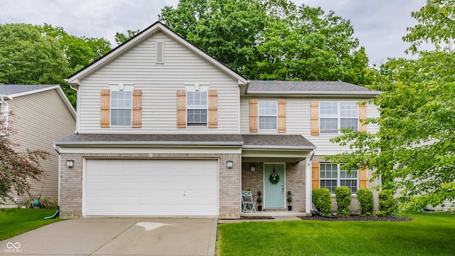 11919 Gatwick View Dr, Fishers, IN 46037 - view of front of home featuring driveway, an attached garage, a front lawn, brick siding, and a shingled roof