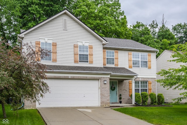 11919 Gatwick View Dr, Fishers, IN 46037 - traditional-style house featuring driveway, a garage, a front yard, brick siding, and roof with shingles