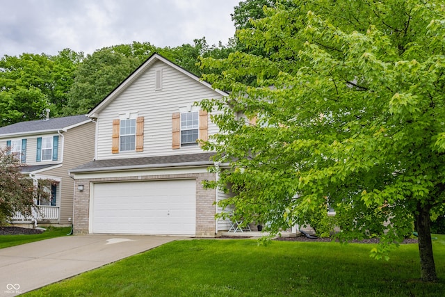 11919 Gatwick View Dr, Fishers, IN 46037 - view of front of house with concrete driveway, an attached garage, a front yard, and brick siding
