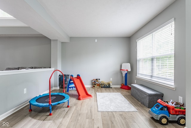 11919 Gatwick View Dr, Fishers, IN 46037 - game room with wood finished floors and baseboards