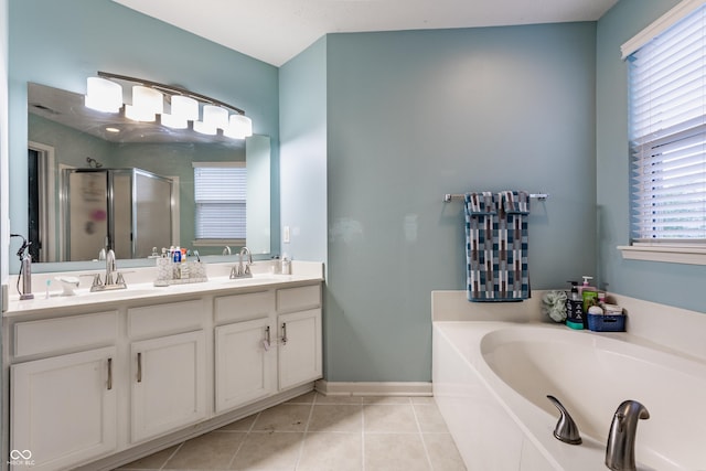 11919 Gatwick View Dr, Fishers, IN 46037 - bathroom featuring a stall shower, a bath, tile patterned flooring, double vanity, and baseboards
