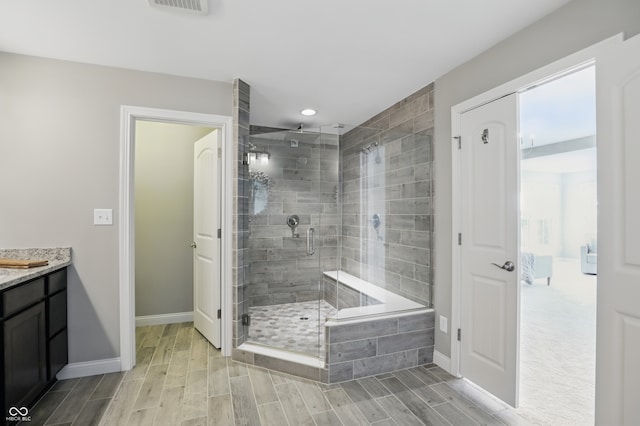 2485 Alexandra Dr, Carmel, IN 46074 - full bathroom with a shower stall, wood finish floors, baseboards, vanity, and recessed lighting