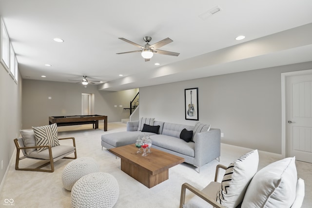 2485 Alexandra Dr, Carmel, IN 46074 - living area featuring light carpet, recessed lighting, stairs, a ceiling fan, and baseboards
