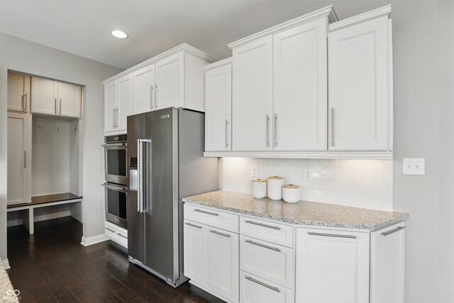 2485 Alexandra Dr, Carmel, IN 46074 - kitchen featuring stainless steel appliances, dark wood-style floors, light stone countertops, recessed lighting, and white cabinets