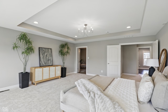 2485 Alexandra Dr, Carmel, IN 46074 - carpeted bedroom featuring a tray ceiling, a chandelier, recessed lighting, and baseboards