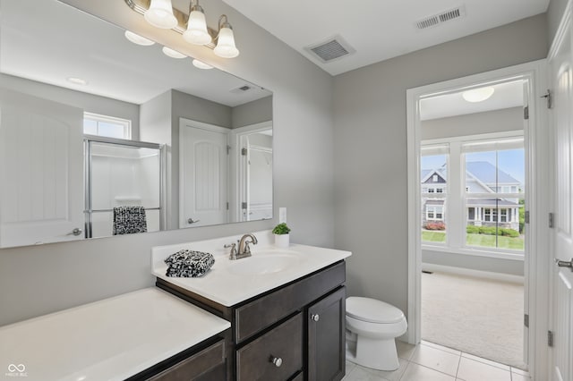 2485 Alexandra Dr, Carmel, IN 46074 - bathroom featuring vanity, tile patterned floors, toilet, a shower stall, and baseboards