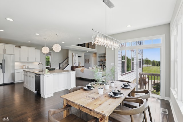 2485 Alexandra Dr, Carmel, IN 46074 - dining space featuring recessed lighting, dark wood-style floors, baseboards, and stairs