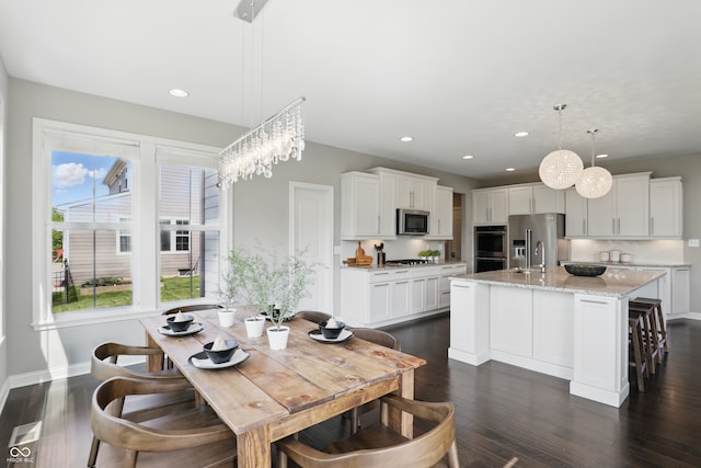 2485 Alexandra Dr, Carmel, IN 46074 - dining room with recessed lighting, baseboards, and dark wood-type flooring