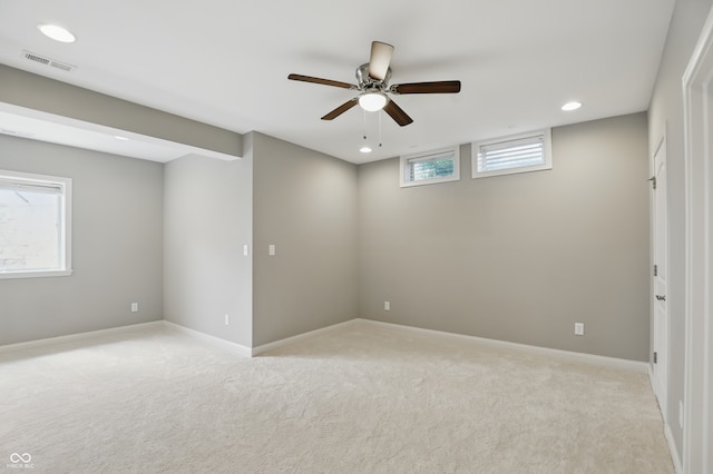 2485 Alexandra Dr, Carmel, IN 46074 - below grade area featuring light carpet, recessed lighting, baseboards, and a ceiling fan