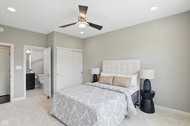 2485 Alexandra Dr, Carmel, IN 46074 - bedroom with light carpet, baseboards, a closet, recessed lighting, and connected bathroom