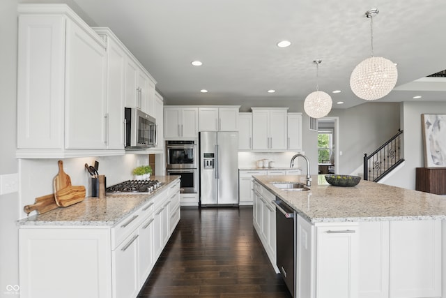 2485 Alexandra Dr, Carmel, IN 46074 - kitchen with stainless steel appliances, a sink, recessed lighting, and white cabinetry