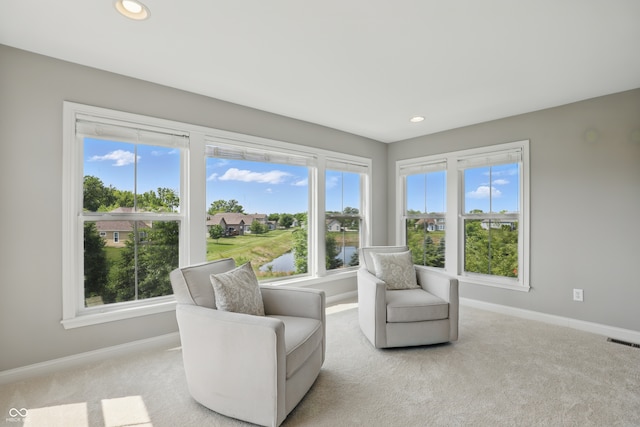 2485 Alexandra Dr, Carmel, IN 46074 - living area featuring baseboards, light carpet, healthy amount of natural light, and recessed lighting