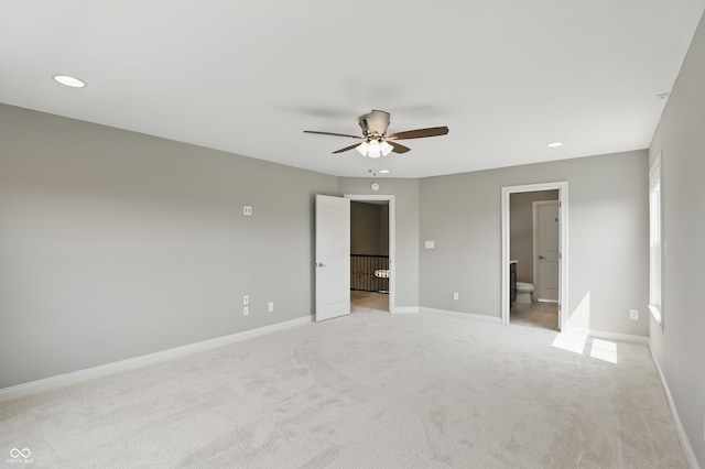 2485 Alexandra Dr, Carmel, IN 46074 - unfurnished bedroom with light carpet, baseboards, recessed lighting, ensuite bath, and a ceiling fan