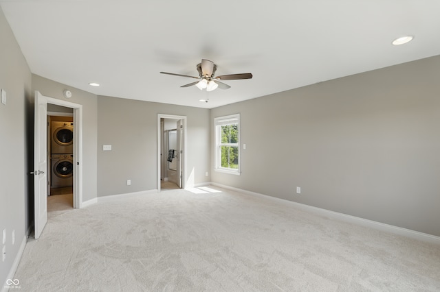 2485 Alexandra Dr, Carmel, IN 46074 - unfurnished bedroom featuring stacked washer / dryer, light carpet, baseboards, recessed lighting, and a ceiling fan