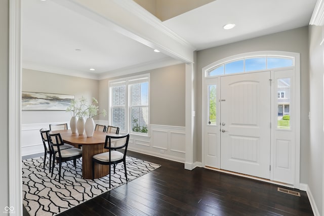 2485 Alexandra Dr, Carmel, IN 46074 - entryway featuring dark wood-style flooring, wainscoting, recessed lighting, ornamental molding, and a decorative wall