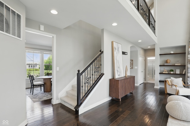 2485 Alexandra Dr, Carmel, IN 46074 - staircase featuring wood-type flooring, baseboards, recessed lighting, and arched walkways