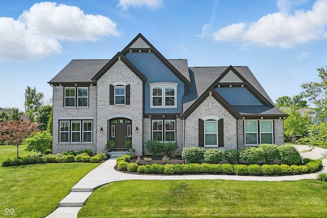 2485 Alexandra Dr, Carmel, IN 46074 - french provincial home with a front yard, brick siding, and a shingled roof