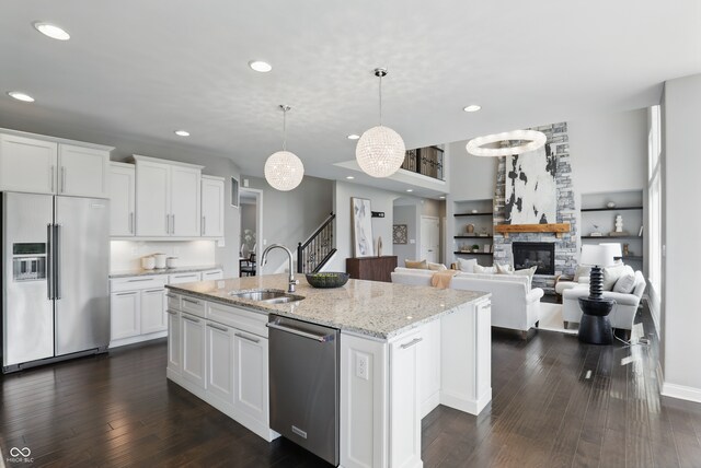 2485 Alexandra Dr, Carmel, IN 46074 - kitchen featuring stainless steel appliances, a sink, recessed lighting, a center island with sink, and white cabinetry