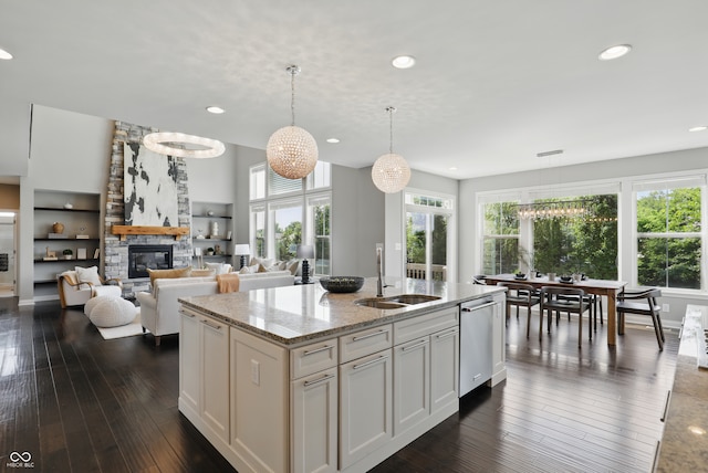2485 Alexandra Dr, Carmel, IN 46074 - kitchen with a sink, dishwasher, recessed lighting, light stone countertops, and a kitchen island with sink