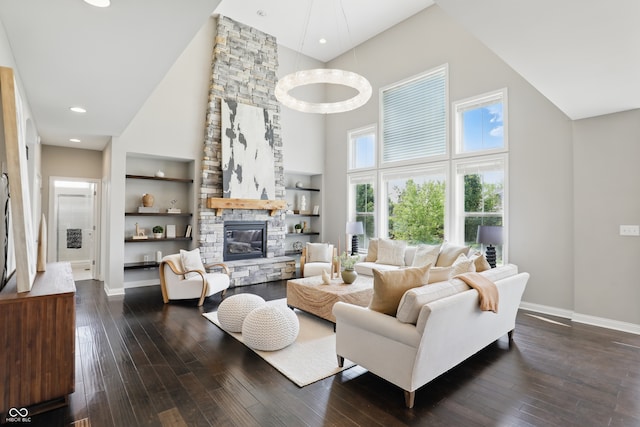 2485 Alexandra Dr, Carmel, IN 46074 - living area featuring high vaulted ceiling, dark wood-style flooring, baseboards, a stone fireplace, and built in features