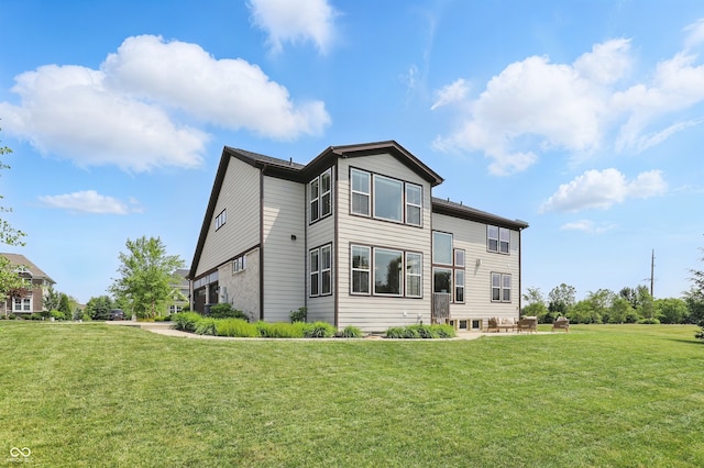 2485 Alexandra Dr, Carmel, IN 46074 - back of house with a lawn