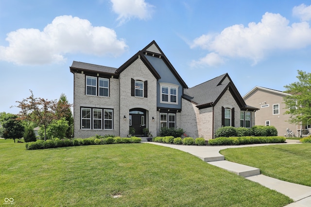 2485 Alexandra Dr, Carmel, IN 46074 - view of front of house with brick siding and a front lawn