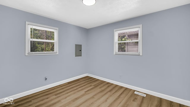 3106 N Harding St, Indianapolis, IN 46208 - spare room with wood finished floors, baseboards, and electric panel