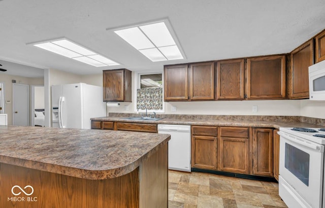 8102 Sycamore Springs Trl, Indianapolis, IN 46239 - kitchen featuring white appliances, a sink, stone finish flooring, and brown cabinetry