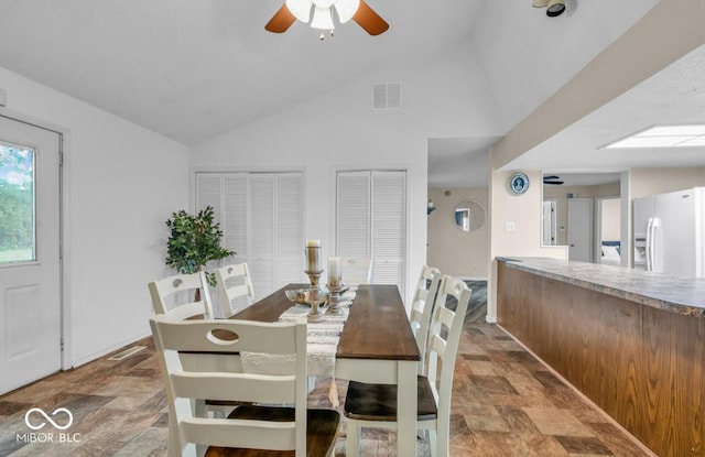 8102 Sycamore Springs Trl, Indianapolis, IN 46239 - dining space featuring stone finish floors, ceiling fan, and high vaulted ceiling