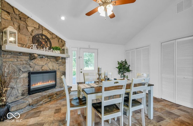 8102 Sycamore Springs Trl, Indianapolis, IN 46239 - dining space featuring vaulted ceiling, stone finish floors, a fireplace, ceiling fan, and recessed lighting