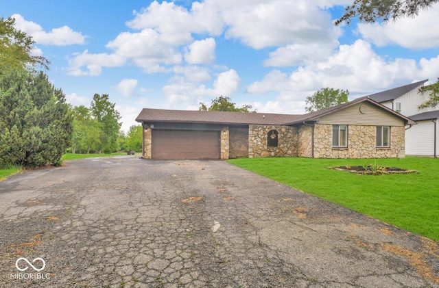 8102 Sycamore Springs Trl, Indianapolis, IN 46239 - view of front of property featuring stone siding, asphalt driveway, an attached garage, and a front yard