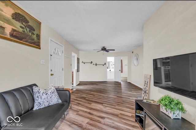 8102 Sycamore Springs Trl, Indianapolis, IN 46239 - living area with wood finished floors, baseboards, and a ceiling fan