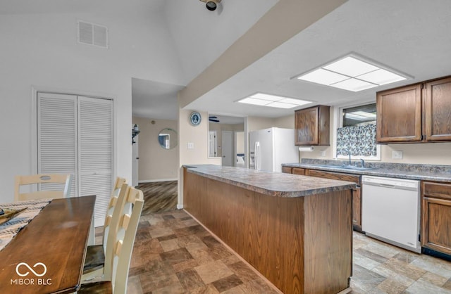 8102 Sycamore Springs Trl, Indianapolis, IN 46239 - kitchen featuring white appliances, a sink, stone finish floors, and baseboards