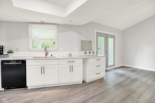 9002 Walton St, Indianapolis, IN 46231 - kitchen with dishwasher, a sink, white cabinetry, light wood finished floors, and light countertops