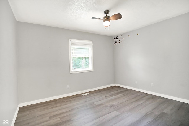 9002 Walton St, Indianapolis, IN 46231 - empty room featuring a ceiling fan, wood finished floors, and baseboards