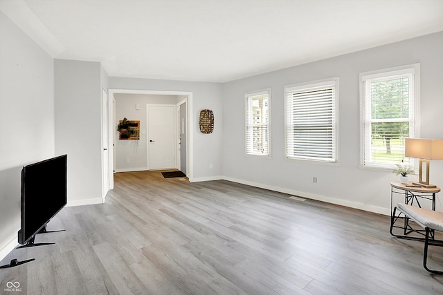 9002 Walton St, Indianapolis, IN 46231 - unfurnished living room with wood finished floors and baseboards