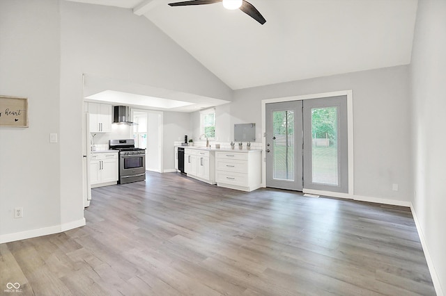 9002 Walton St, Indianapolis, IN 46231 - unfurnished living room with high vaulted ceiling, ceiling fan, beamed ceiling, baseboards, and light wood finished floors