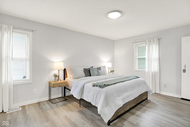 9002 Walton St, Indianapolis, IN 46231 - bedroom with wood finished floors and baseboards