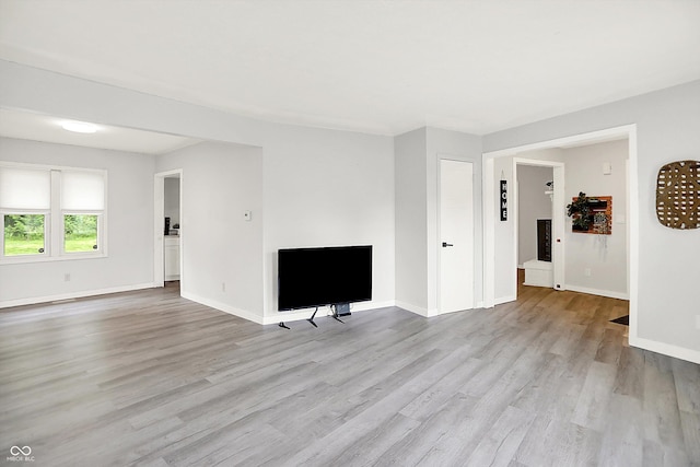 9002 Walton St, Indianapolis, IN 46231 - unfurnished living room featuring wood finished floors and baseboards