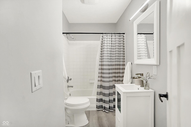 9002 Walton St, Indianapolis, IN 46231 - full bath featuring toilet, shower / bathtub combination with curtain, wood finished floors, and vanity